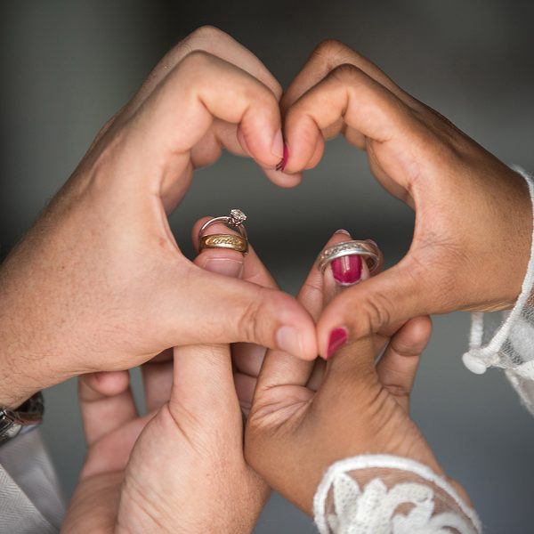 couple creative photo with wedding rings