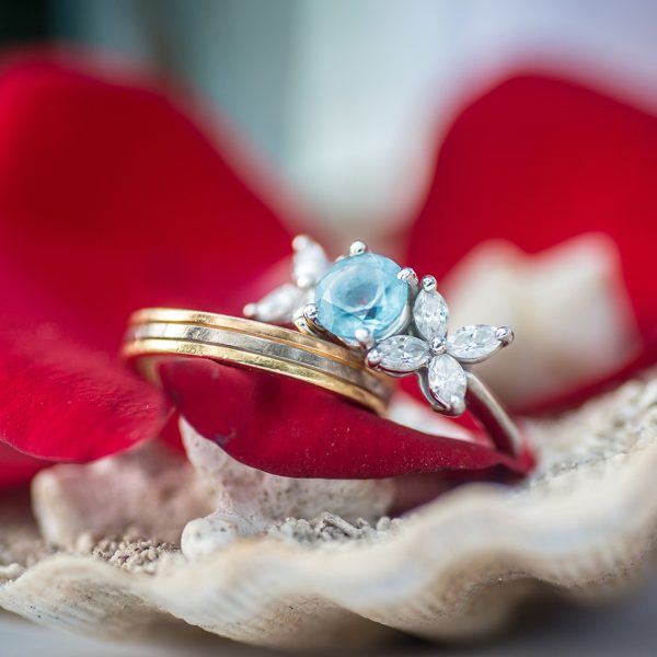 close up shot of wedding rings on shells