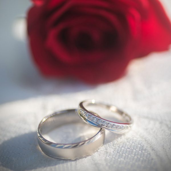 Beautiful ring with red flower in background