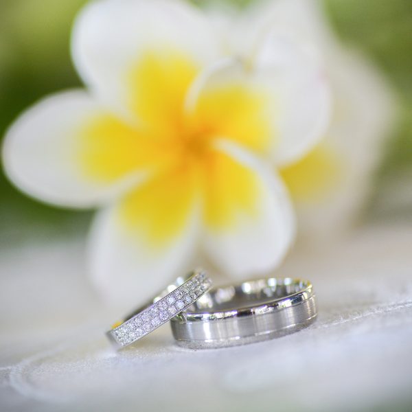 wedding ring with yellow flower in background
