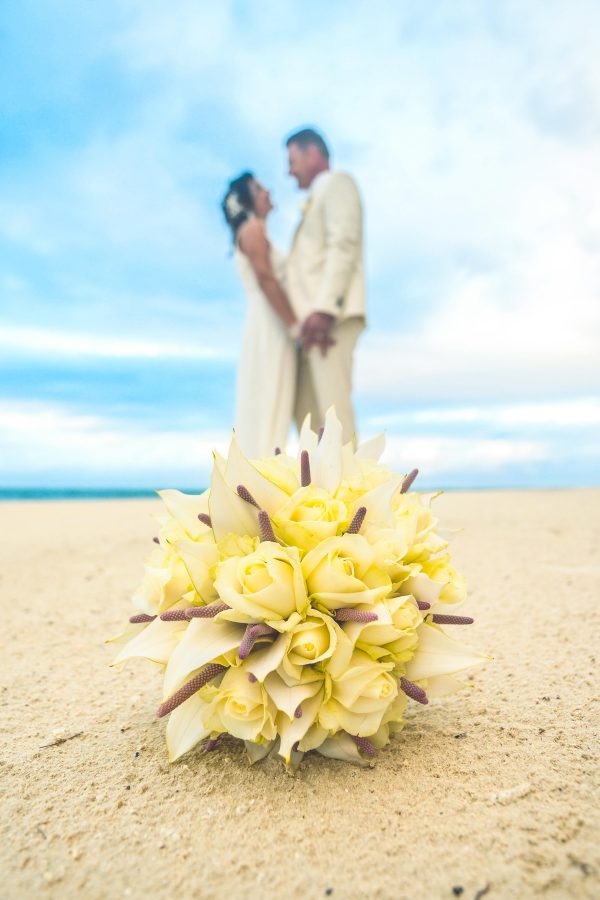 couple holding each other on the beach 