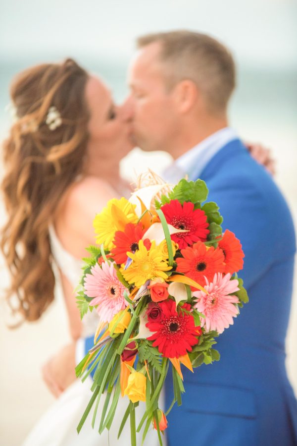 nice couple kissing on the white sand