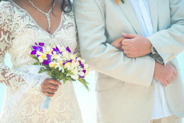 bride and groom holding each other during ceremony