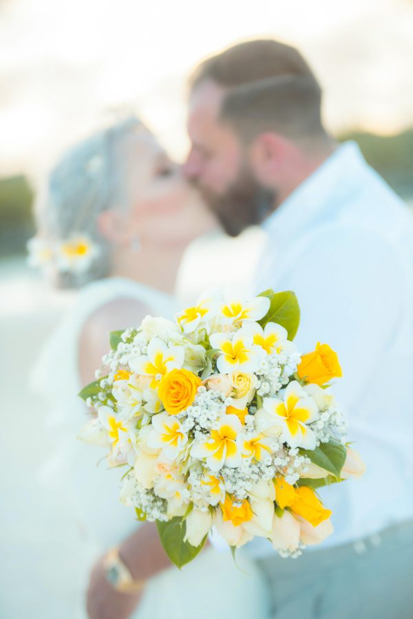 beautiful couple kissing on the beach