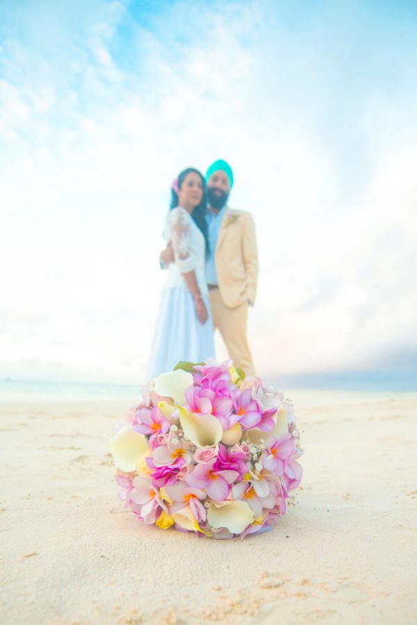 nice punjabi couple holding each other on the beach