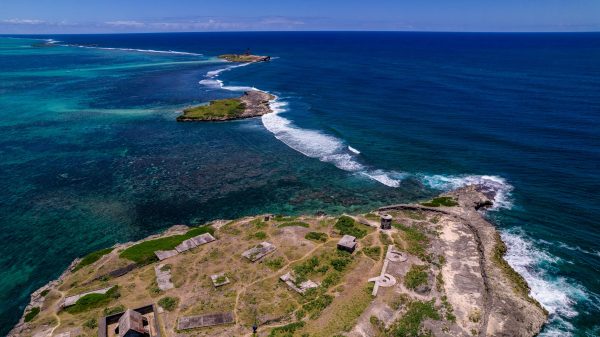 drone photo of small island in blue sea