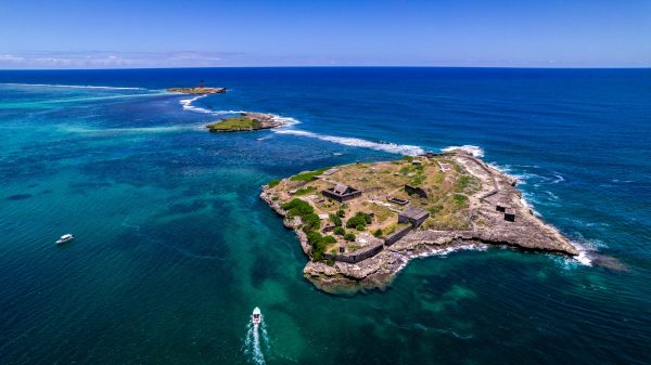 drone photo of small island in blue sea