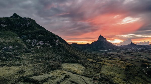 Drone shot of le pouce with red sky mountain